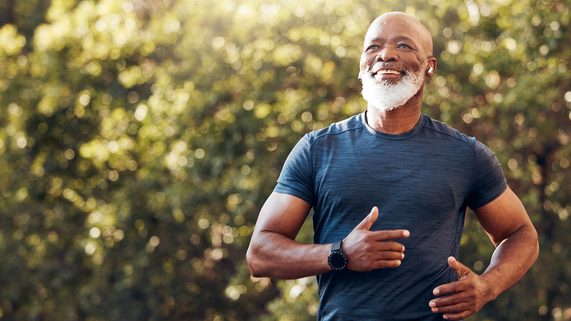 A man running and looking happy.