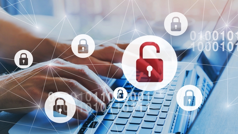 Somebody typing on a laptop, with an open lock icon over their hands.