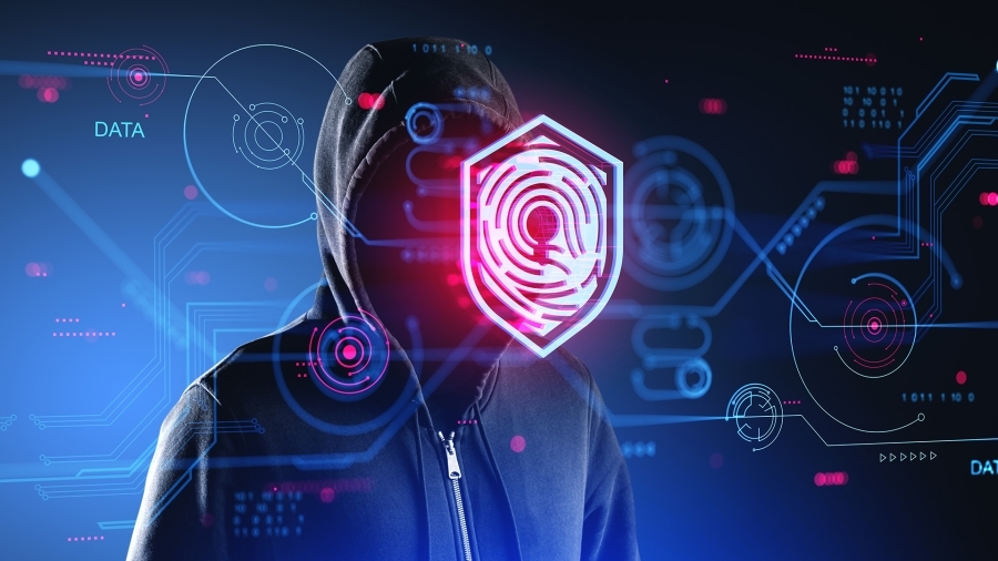 A hacker wearing a hoodie, with the image of a fingerprint scanner over their face.