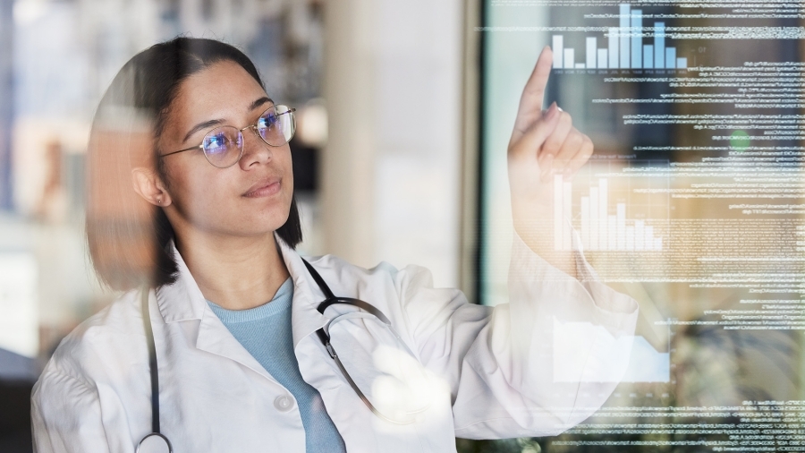A nurse using a touch-screen device.
