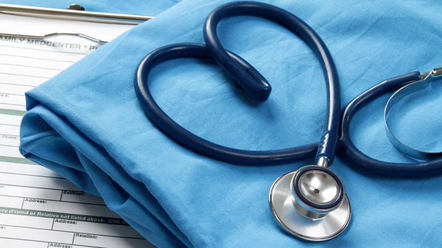 A stethoscope with its cord in the shape of a heart.