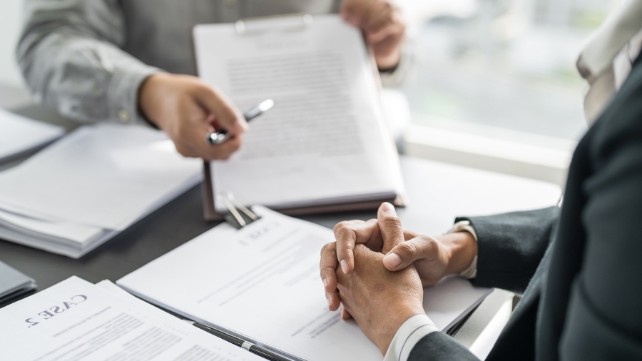 Two people looking over paperwork.