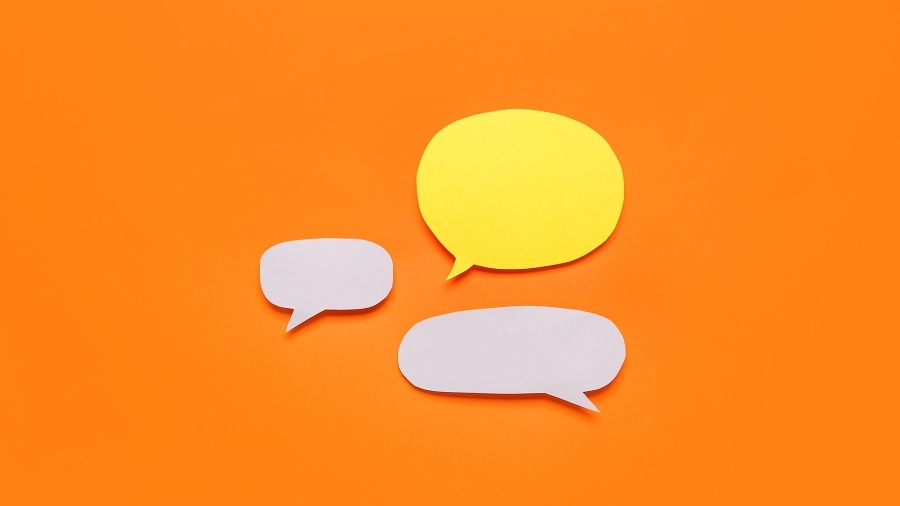 Yellow and white speech bubbles on an orange background.
