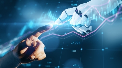 A human hand reaching out and touching fingers with a robot hand.
