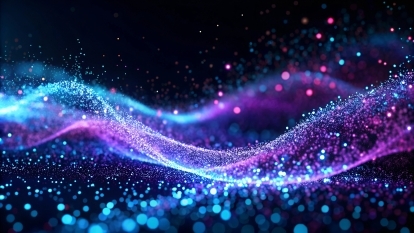 Blue and purple particles flowing in a wave. 