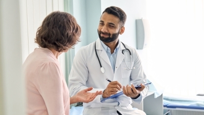 A doctor talking to a patient.