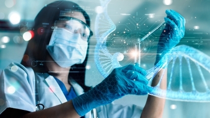 A scientist pipetting chemicals.