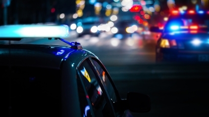 A police car with its lights flashing.