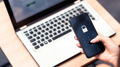 Somebody holding a locked iPhone.
