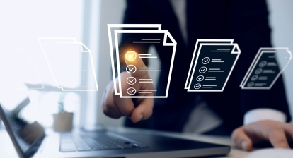 Somebody pointing at icons of documents.